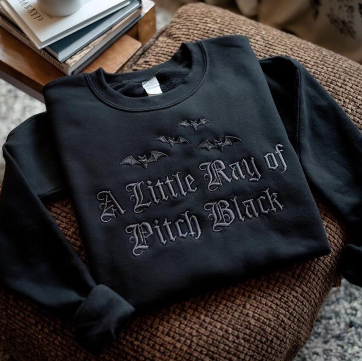 A Little Ray of Pitch Black Sweatshirt